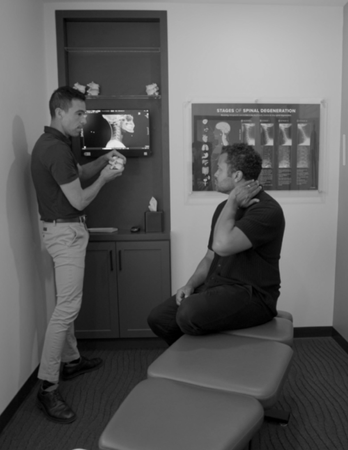 Doctor reviewing X-ray with patient